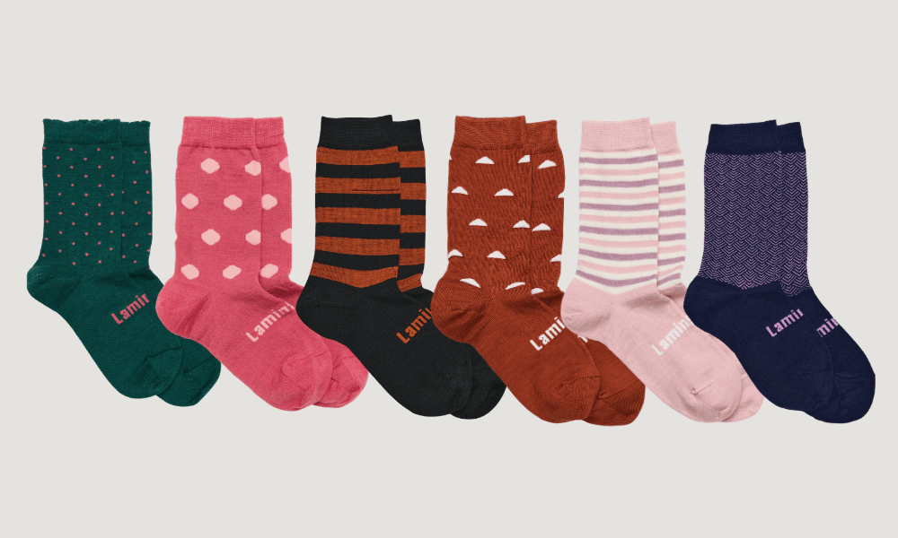 Fashion statement socks collection featuring colorful patterns and designs, reflecting style and social messages.