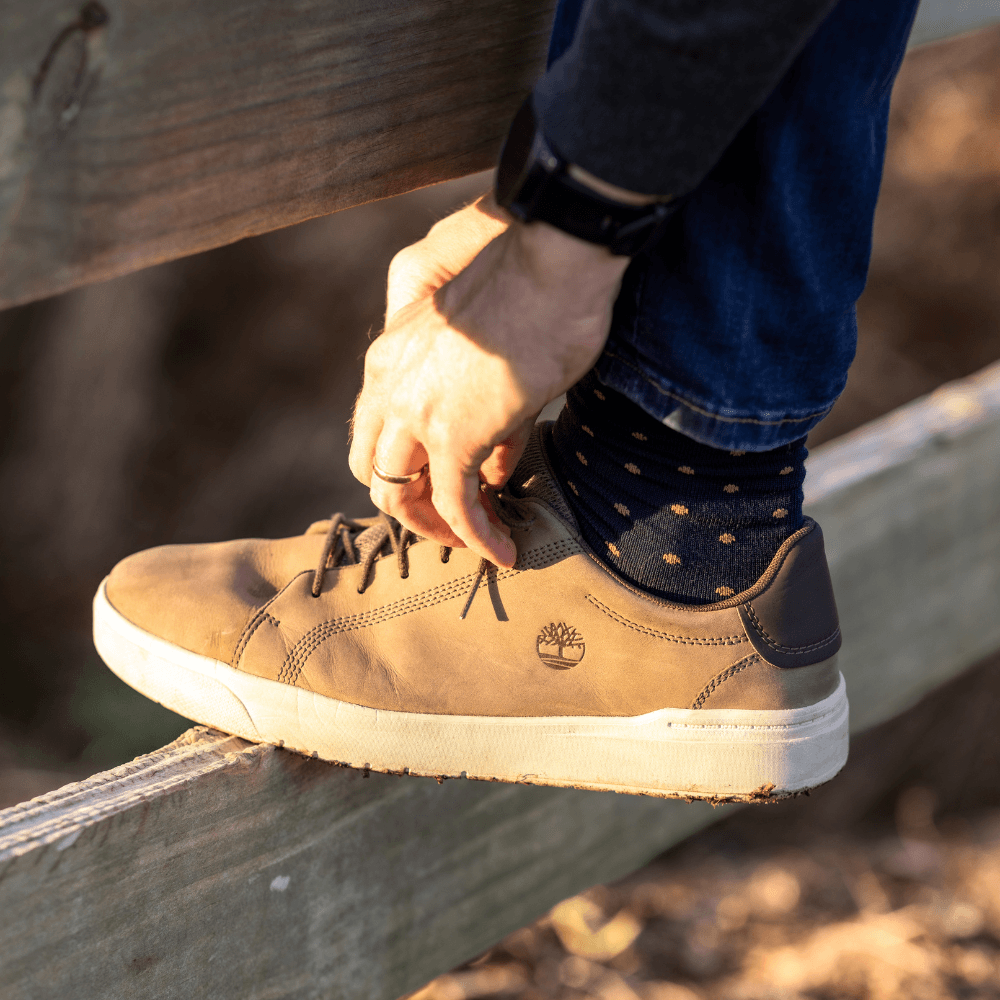 Lamington men's merino soft cuff crew socks in navy with mustard spots made in New Zealand.