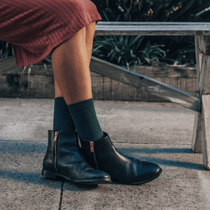 woman wearing green rib crew socks with boots